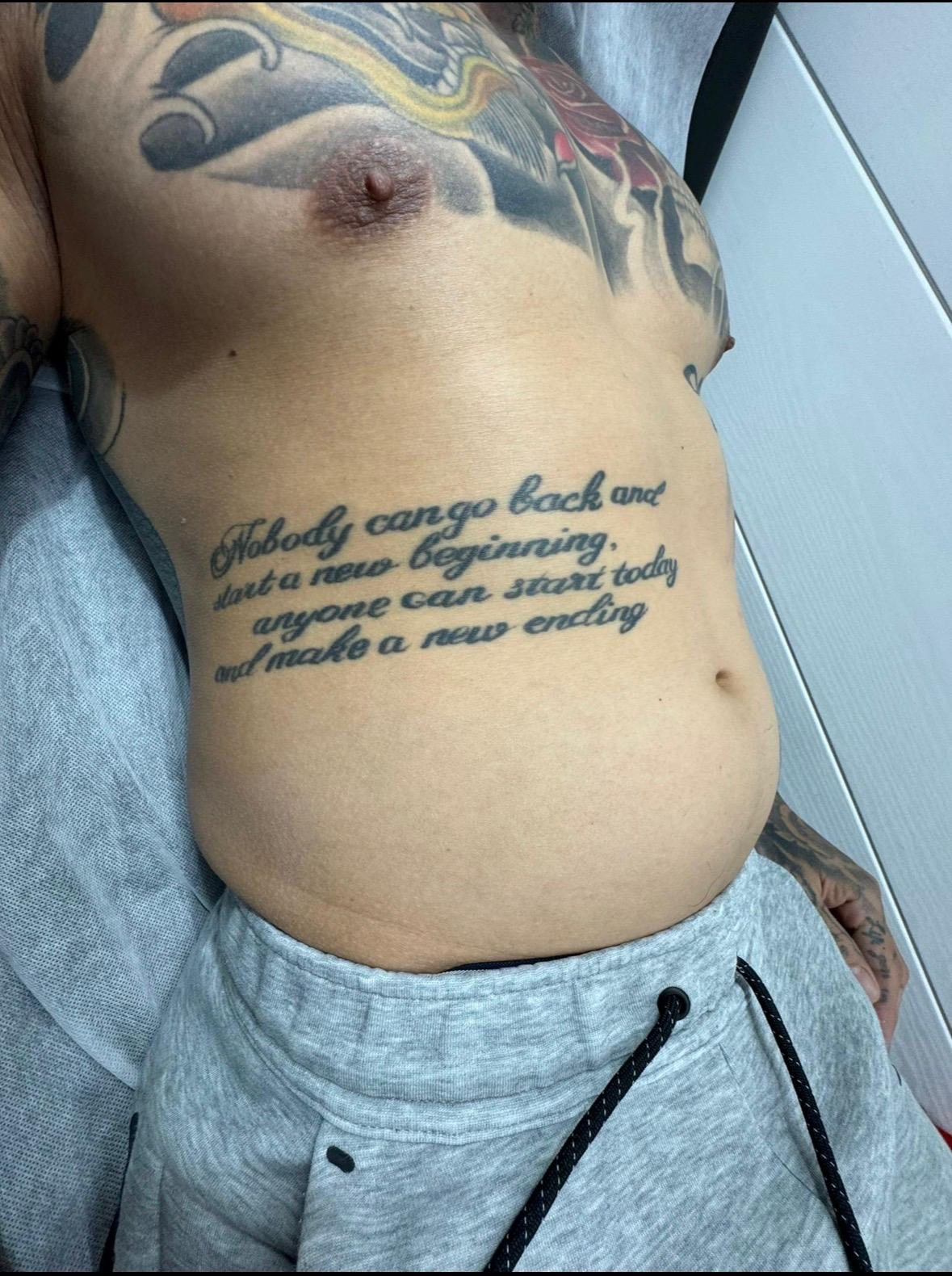 Script tattoo on the torso before treatment